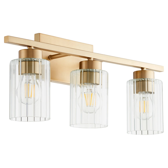 Quorum 501-3-280 Three Light Vanity, Aged Brass w/ Clear Fluted Glass