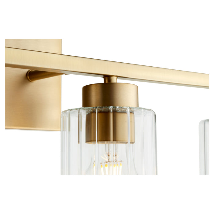 Quorum 501-4-280 Four Light Vanity, Aged Brass w/ Clear Fluted Glass