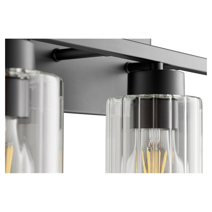 Quorum 501-4-69 Four Light Vanity, Textured Black w/ Clear Fluted Glass